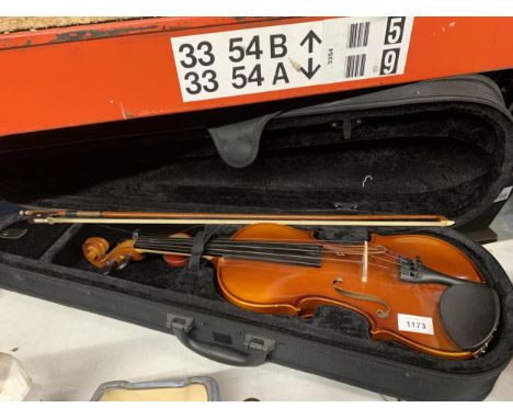 A CASED VIOLIN AND BOW 