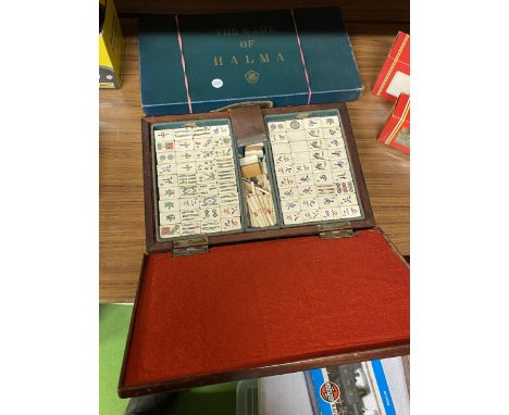 A VINTAGE WOODEN CASED MAHJONG SET AND A BOXED HALMA GAME 