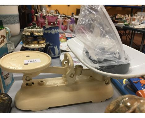 A SET OF VINTAGE CAST SCALES WITH WEIGHTS AND MAKERS NAME 
