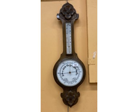 A VINTAGE MAHOGANY BAROMETER WITH CARVING TO TOP AND BOTTOM 