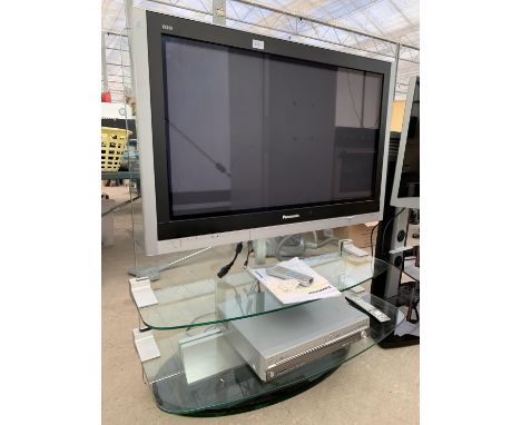 A PANASONIC 37" TELEVISION ON GLASS TV STAND WITH REMOTE CONTROL AND PANASONIC DVD/VHS RECORDER 