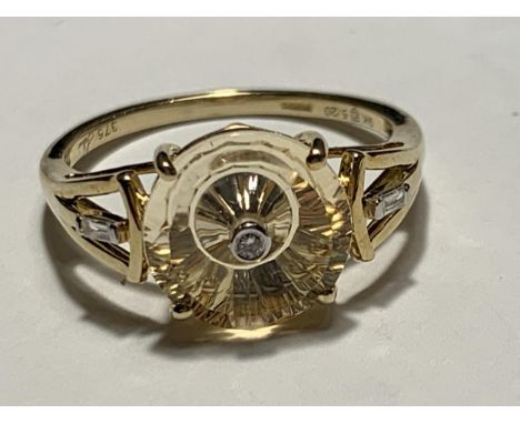 A 9 CARAT GOLD RING WITH THREE DIAMONDS SIZE O 