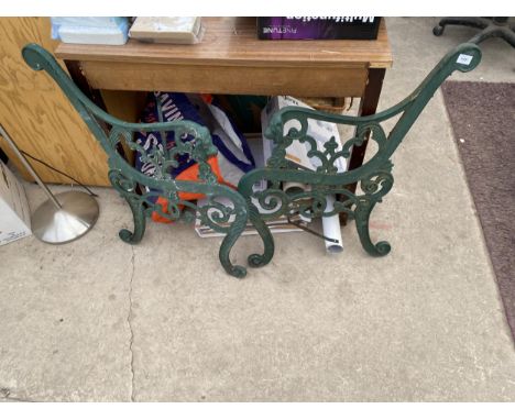A PAIR OF LION HEAD CAST IRON BENCH ENDS 