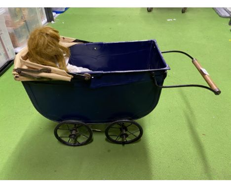 A VINTAGE METAL PRAM WITH PORCELAIN HEADED DOLL 