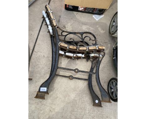 A PAIR OF CAST METAL BENCH ENDS 