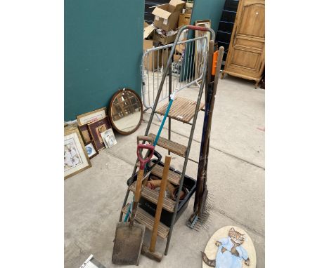 AN ASSORTMENT OF TOOLS TO INCLUDE A STEP LADDER, SPADES AND SHOVELS ETC 