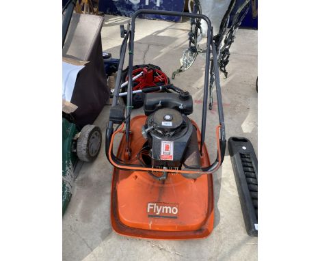 A FLYMO LAWN MOWER WITH PETROL ENGINE 