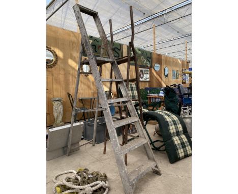 A FIVE RUNG ALUMINIUM STEP LADDER AND A FIVE RUNG TUBULAR METAL STEP LADDER 