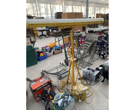 A 110V TRANSFORMER AND A 110V WORK LIGHT ON TRIPOD STAND 