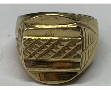 A YELLOW METAL RING 