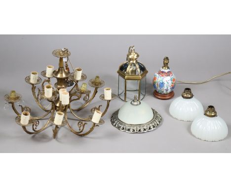 A vintage-style brass eight-branch chandelier hung with prism drops, 62cm wide x 40cm high; together with a pendant lamp; a t