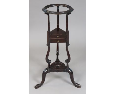 A late 18th century mahogany basin-stand with circular open top, fitted tow small drawers, on turned supports and three cabri