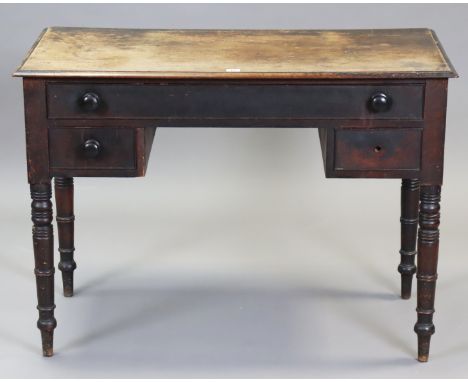 A 19th century mahogany knee-hole dressing table fitted one long &amp; two short drawers, &amp; on four ring-turned tapered l
