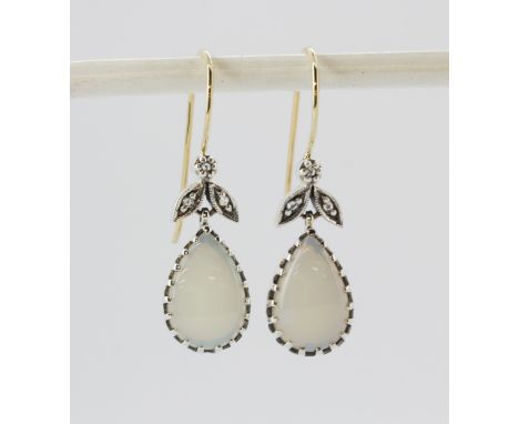 A lovely pair of opal and diamond earrings with 9ct gold wires and 925 silver settings.