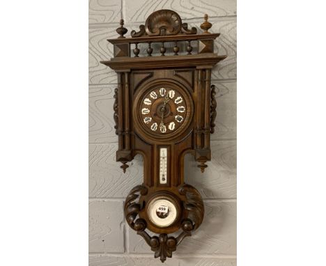 A carved oak wall clock barometer, H. 89cm.