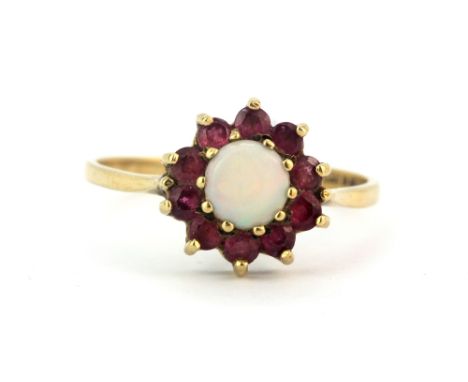 A 9ct yellow gold opal and ruby set cluster ring, (R.5).