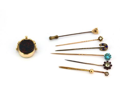 An assortment of seven antique stick pins, one 9ct gold, set with a variety of stones including diamond, opal, turquoise, etc