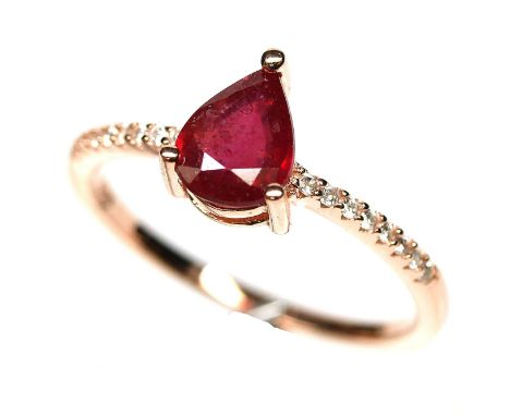 A 925 silver rose gold gilt ring set with a pear cut ruby and white stone set shoulders, (P.5).