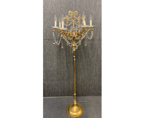 An unusual gilt and crystal standard lamp.