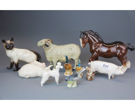 A group of Beswick and other ceramic animal and bird figures.