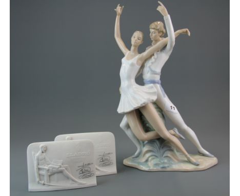 A large Nao figure of a couple dancing, H. 40cm. Together with two Lladro product panels.