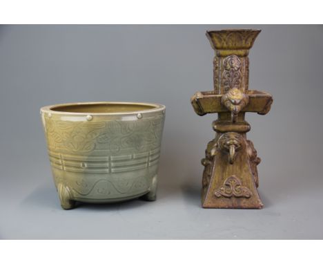 An early Chinese incised and celadon glazed planter with kiln firing colour variation together with a relief decorated celado
