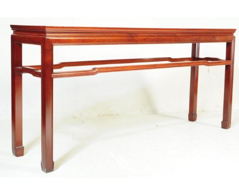 A contemporary Chinese hardwood side / console table. Of rectangular form with a bordered top on square upright supports unit