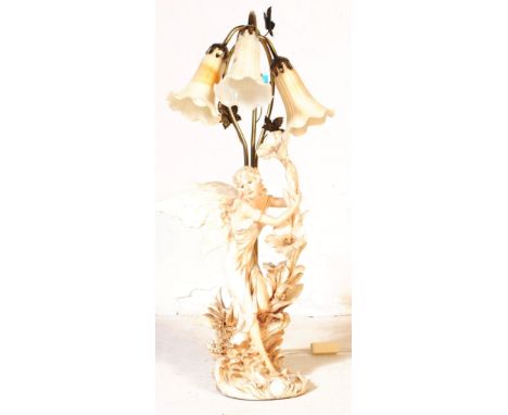 A contemporary fairy desk table lamp light. Having three gilt metal tubular arms terminating in lights with glass floral shad