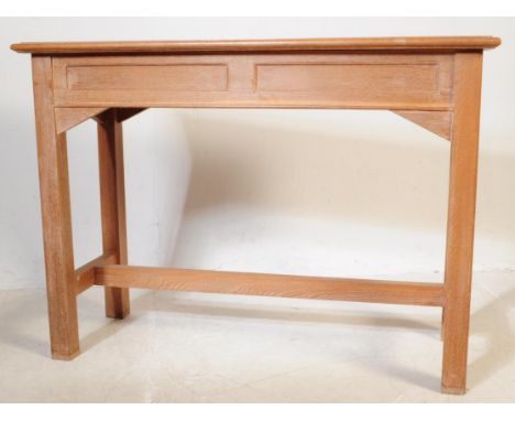 A mid 20th century circa 1960s oak ecclesiastic altar console table with chairs. The table of rectangular form with panelled 