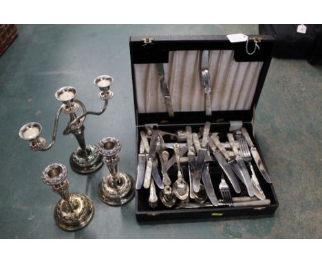 Boxed candelabra, pair of candlesticks and a canteen of cutlery 