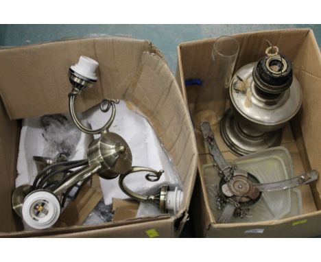Two boxes of light fittings and oil lamp