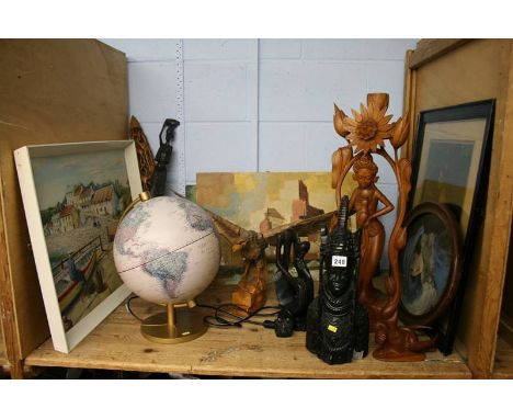 Shelf of carved ethnographical items etc.