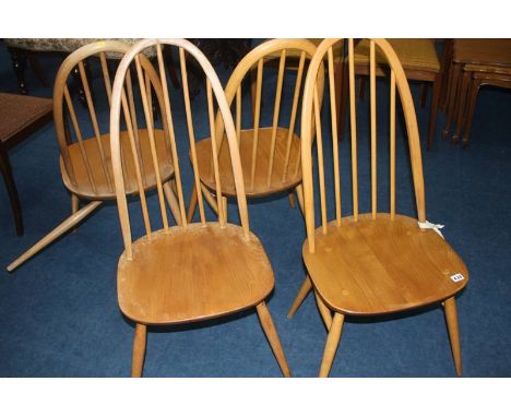 A set of four Ercol hoop back chairs 