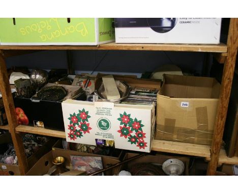 A shelf of miscellaneous, DVDs, CDs etc.