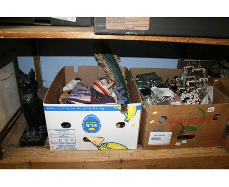 A shelf of assorted, religious icons etc.