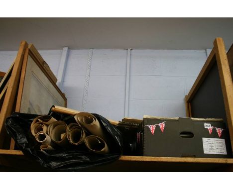 A shelf of artists sketchbooks, watercolours etc.