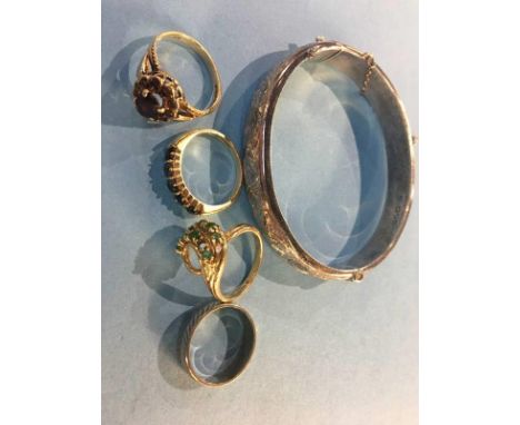 Four 9ct dress rings, 12.7g, together with a silver bangle