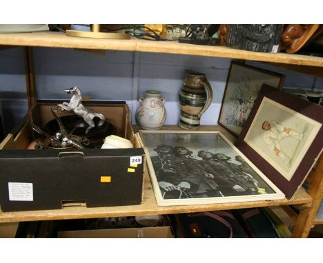 A shelf of assorted, Vanity Fair print etc.