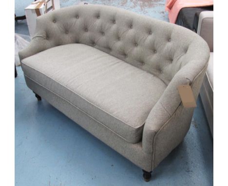 SOFA, with a buttoned, curved back and grey upholstery on short turned front supports, 146cm L. 