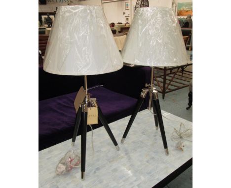 TABLE LAMPS, a pair, of contemporary ebony and cream finish with adjustable tripod caps and silk shades, 76cm H. (2)