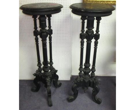JARDINIERE STANDS, a pair, late 19th century Continental ebonised, each with four fluted column supports and tripod base. (2)