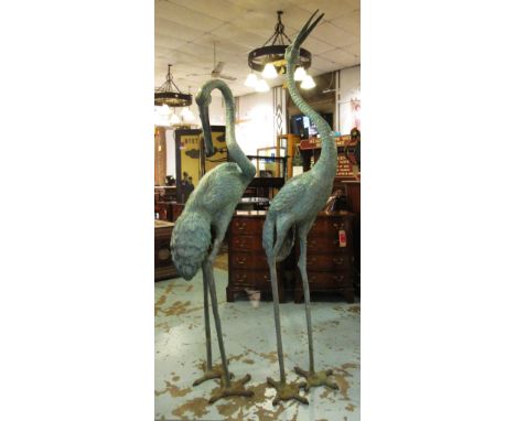 HERONS, a pair, Japanese Meji style, patinated bronze, 180cm x 153cm H. (2)