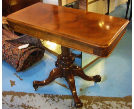 CARD TABLE, mid Victorian figured walnut with fold-over action top and circular green baize lining baluster column and quadru
