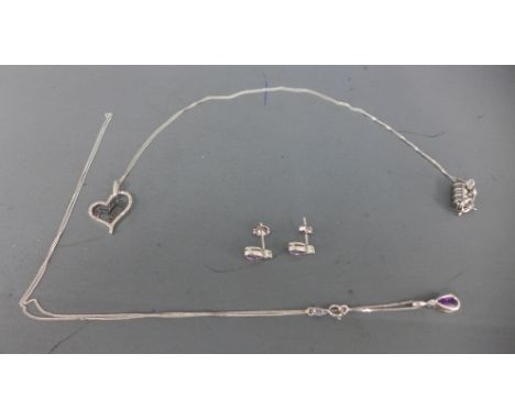 A 9ct white gold and amethyst necklace with matching earrings and a 9ct white gold necklace with heart shaped pendant - appro