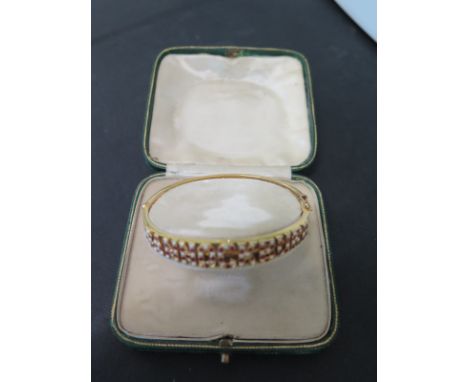 A 15ct gold seed pearl and ruby bangle Bannockburn approx weight 13 grams - good condition