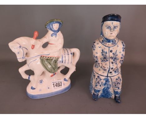 A Delftware figural jug and a Rye pottery figure - 19cm tall