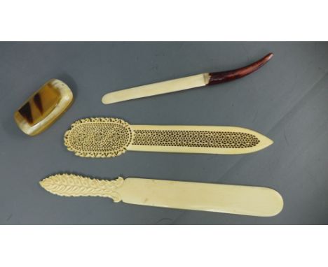 Three Victorian ivory letter openers and a horn snuff box - all in reasonably good condition, some chipping to fretwork opene