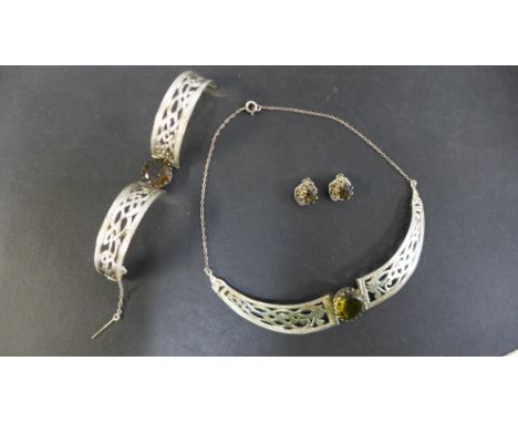 A silver and citrine Celtic art design necklet, bangle and  clip earrings hallmarks for Edinburgh 1978 and 1977 Elizabeth II 