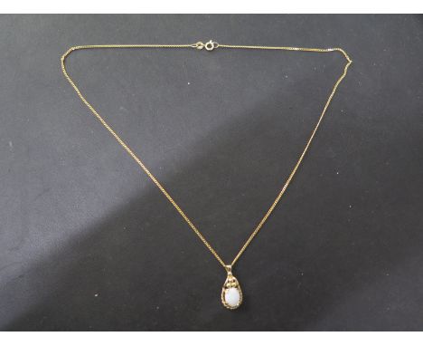 A 9ct gold opal pendant on a 9ct gold chain - Length 46cm - good overall condition - total weight approx 3 grams