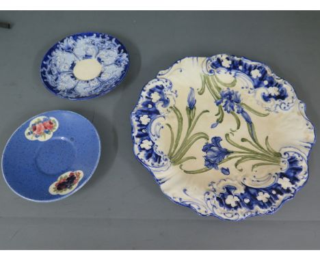 A William Moorcroft Florian ware Macintyre saucer, another William Moorcroft saucer and a Macintyre plate - diameter 20cm - s